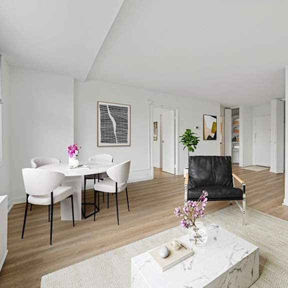 a modern living room with a dining table and chairs.at sherwood at southern towers, alexandria