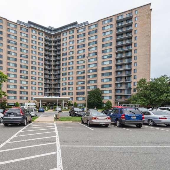 a parking lot in front of a large apartment building.at sherwood at southern towers, alexandria, va 22311