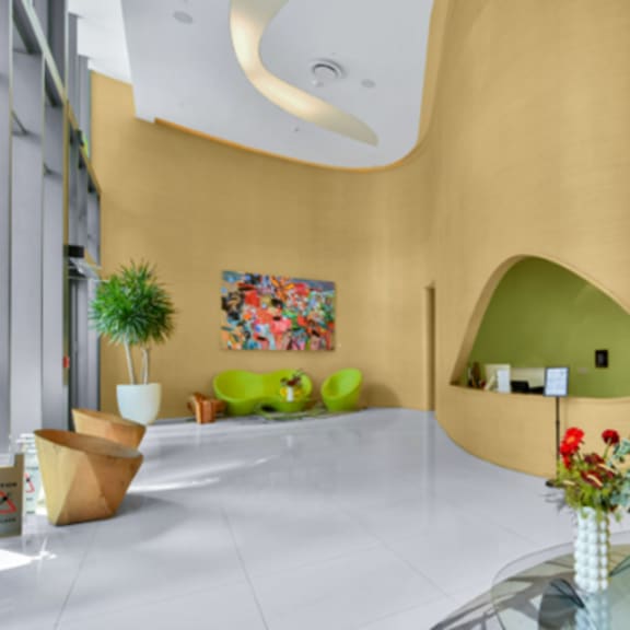 a modern interior with a yellow wall and a green alcove.