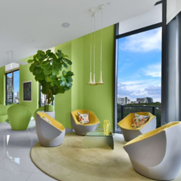 a modern living room with green and yellow accents.