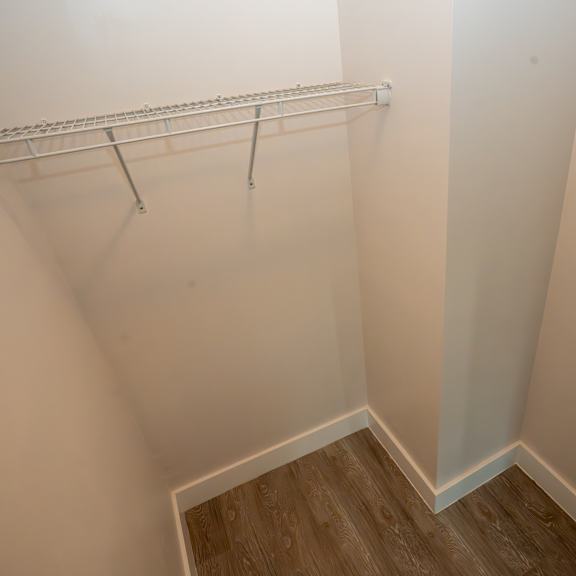 a white wall with a metal rack on it.