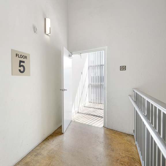 a hallway with a sign that says "floor 5".