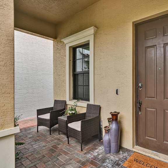 main entrance porch, chairs, and waterfall.