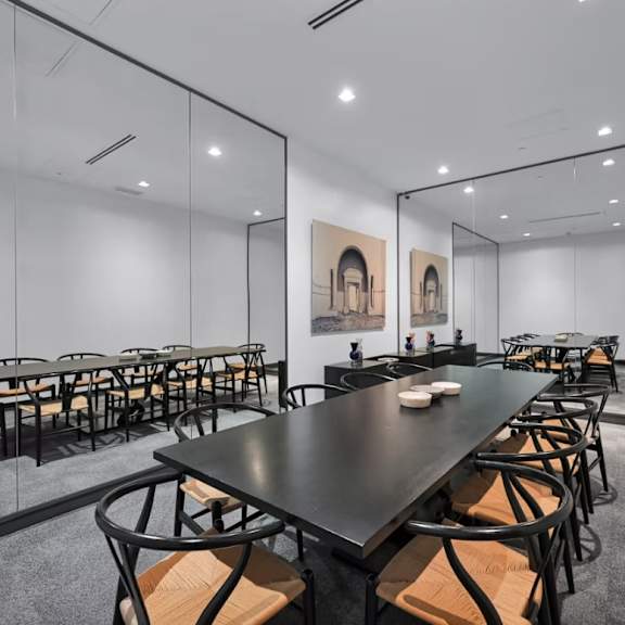 a conference room with a long table and chairs.