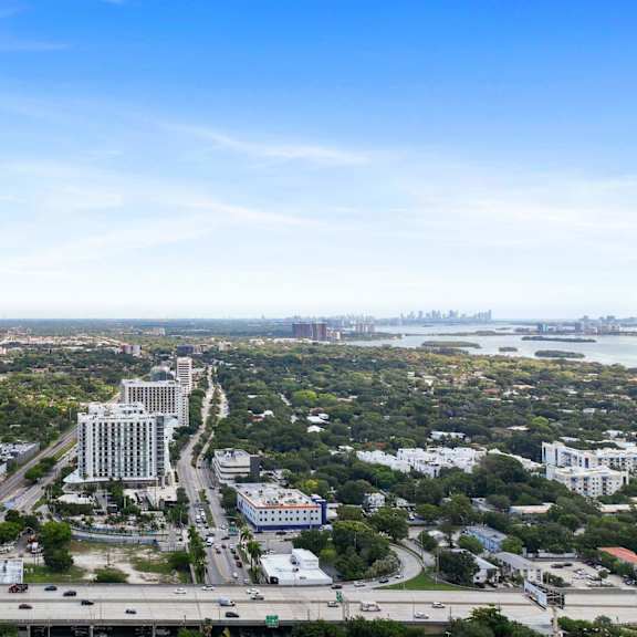 a cityscape with a clear blue sky above.