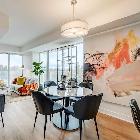 modern dining area with contemporary furniture and artwork at baseline apartments, ottawa, on k2h 0c9