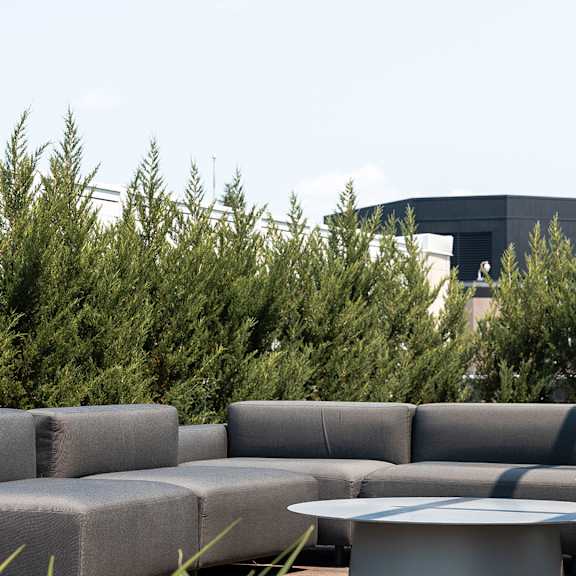 outdoor terrace seating area with sectional sofa at baseline apartments, ottawa, ontario