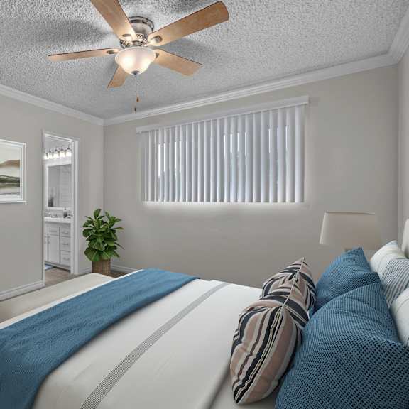 a bedroom with a bed, pillows, a ceiling fan, and a window with blinds.