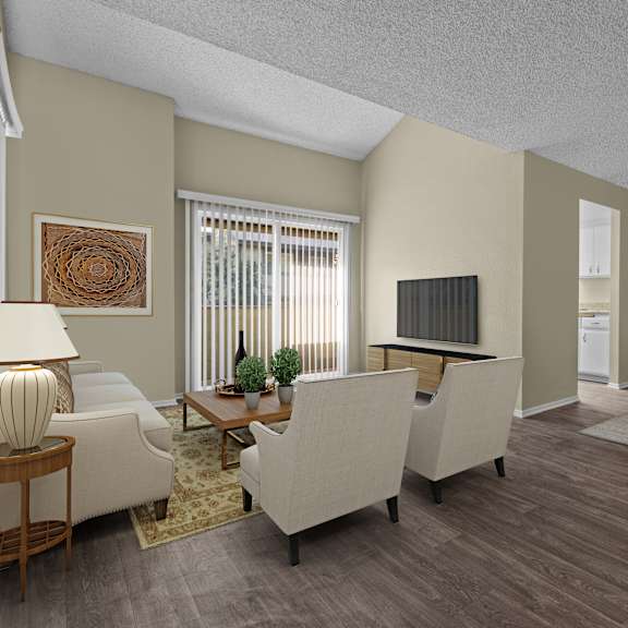a living room with a white couch, a wooden coffee table, and a ceiling fan.
