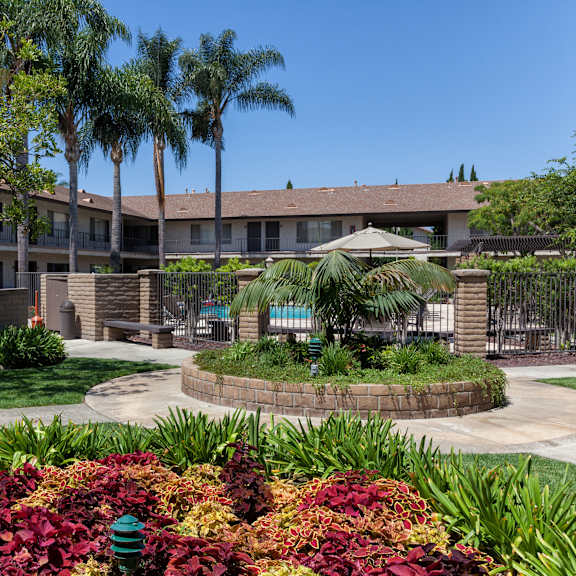 a building with a green lawn in front of it.