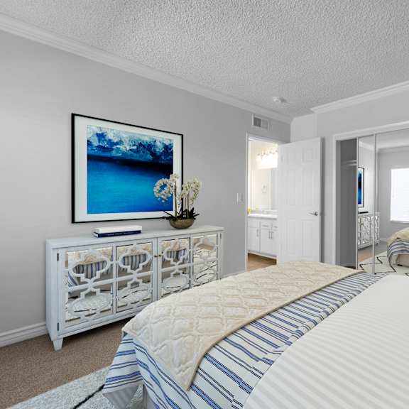 a bedroom with a large bed and a painting on the wall.