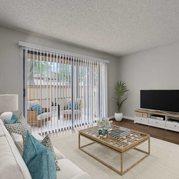 a living room with a white couch, a wooden coffee table, and a flat screen tv.