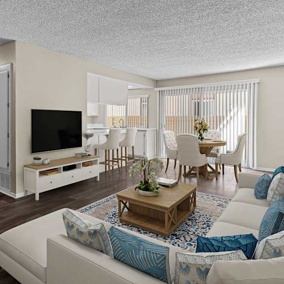 a living room with a white couch and a wooden coffee table.