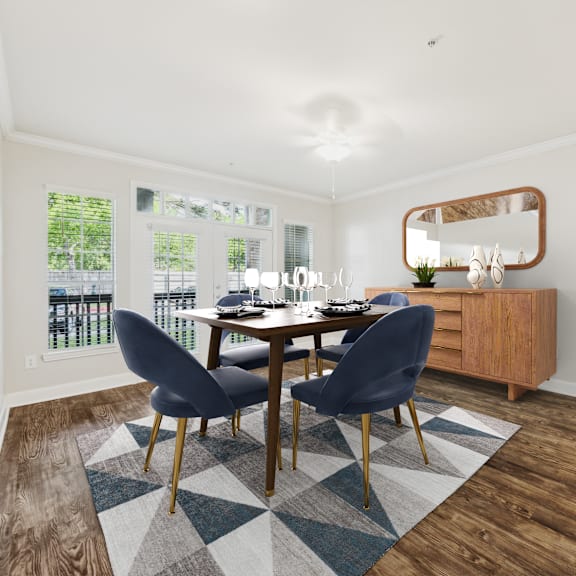 a dining room with a table and chairs.