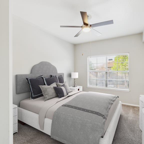 a bedroom with a large bed and a television on a stand.
