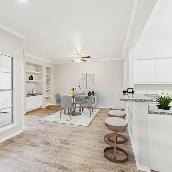 a modern kitchen with a dining table and chairs.