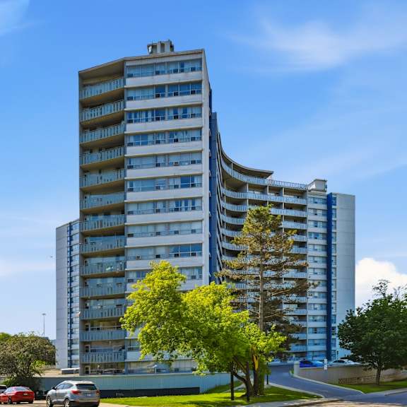 a tall building with a blue sky in the background.
