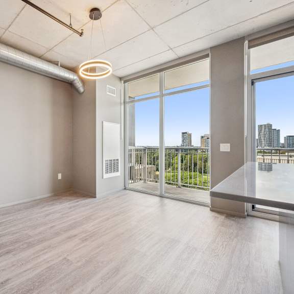 a room with a large window overlooking a cityscape.