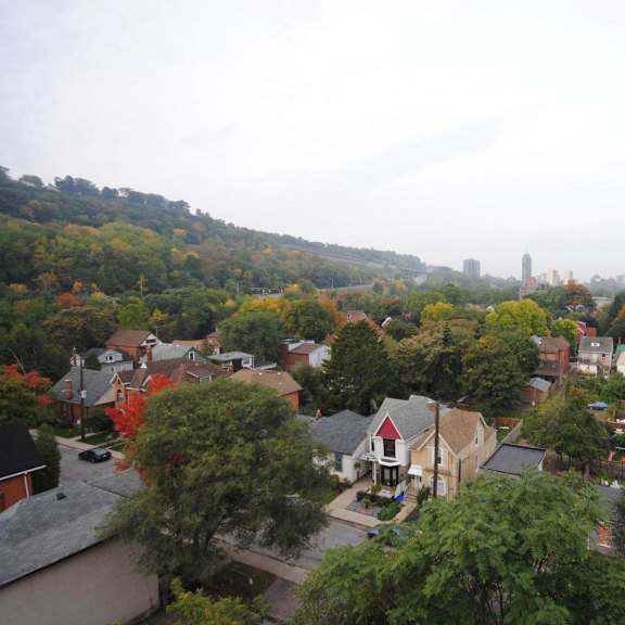 a view of a residential area with houses and trees.