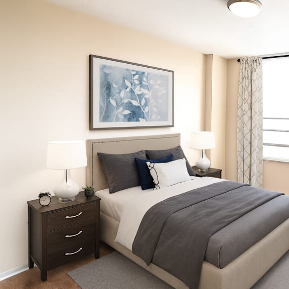 a bedroom with a large bed, a nightstand with a lamp, and a chair by the window.