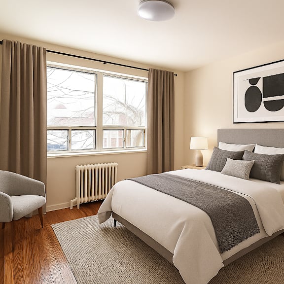 a bedroom with a large bed, a chair, and two framed pictures on the wall.