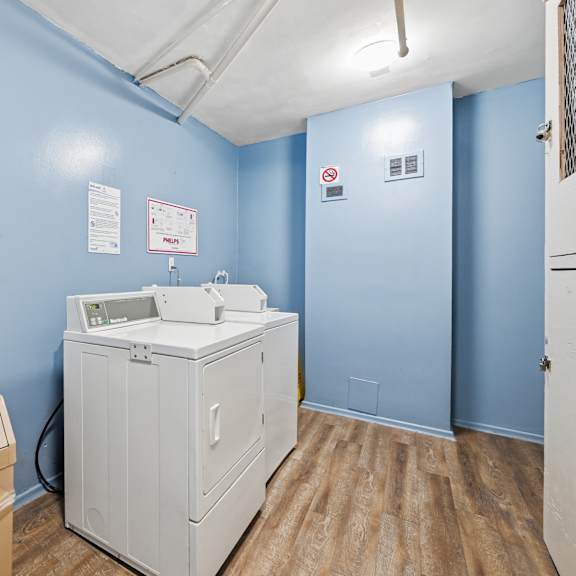 a room with a sink and a box on the floor.