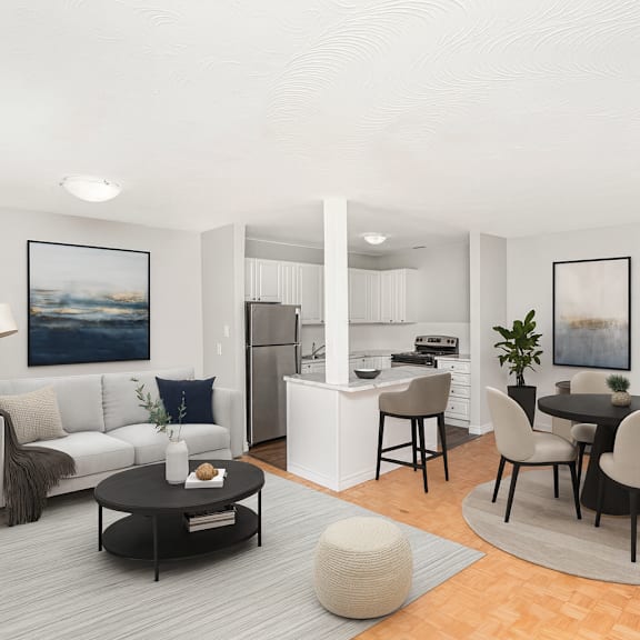 a modern living room with a grey sofa, a black coffee table, and a dining table with chairs.