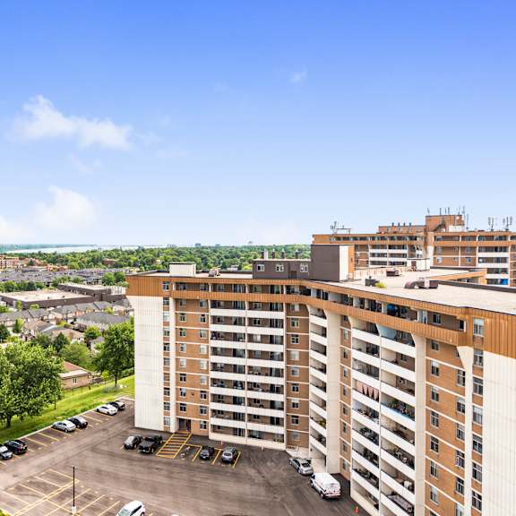 a large building with a parking lot in front of it.