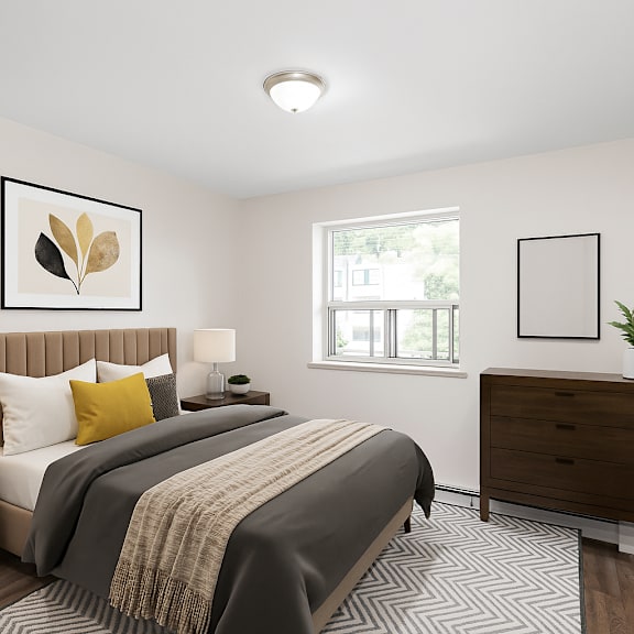 a bedroom with a large bed and a window.