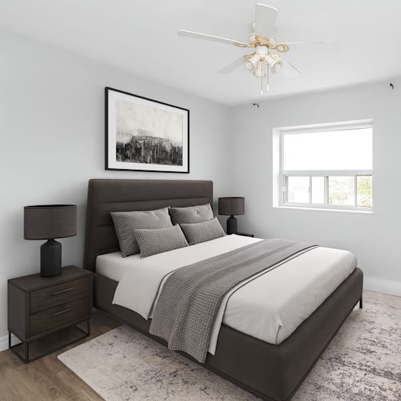a bedroom with a large bed, a nightstand, and a dresser.