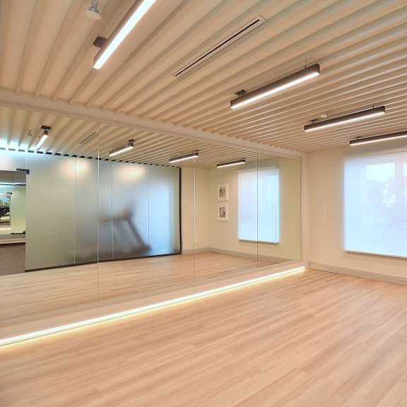 a room with wooden floors and a glass wall at roxy apartments, hamilton, on, l8h 0b7