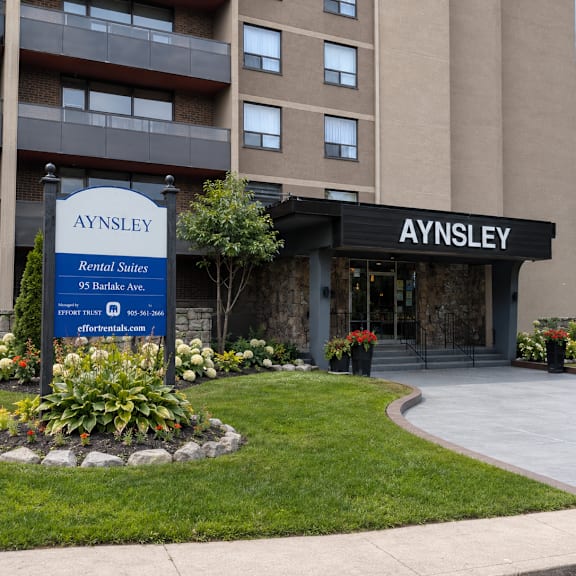 aysley rentals site in front of a building.