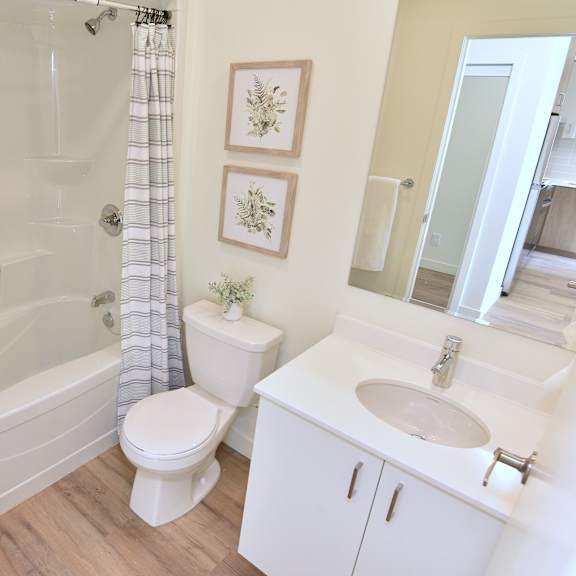 a white bathroom at roxy apartments, hamilton