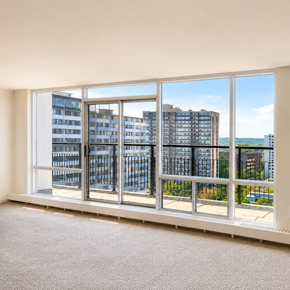 a room with a large window overlooking a cityscape.