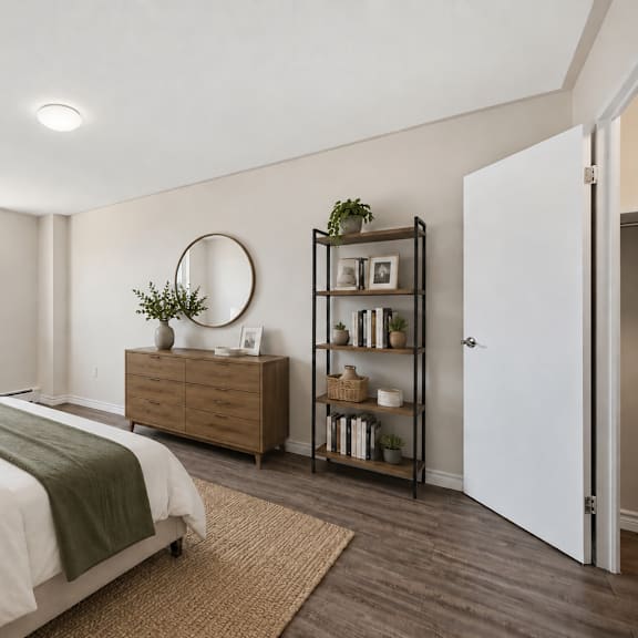 a bedroom with a large bed and a window overlooking a building.