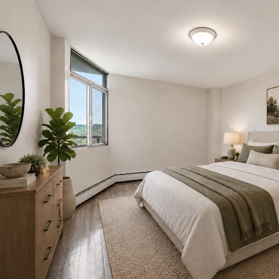 a bedroom with a large bed, a mirror, and a painting on the wall.