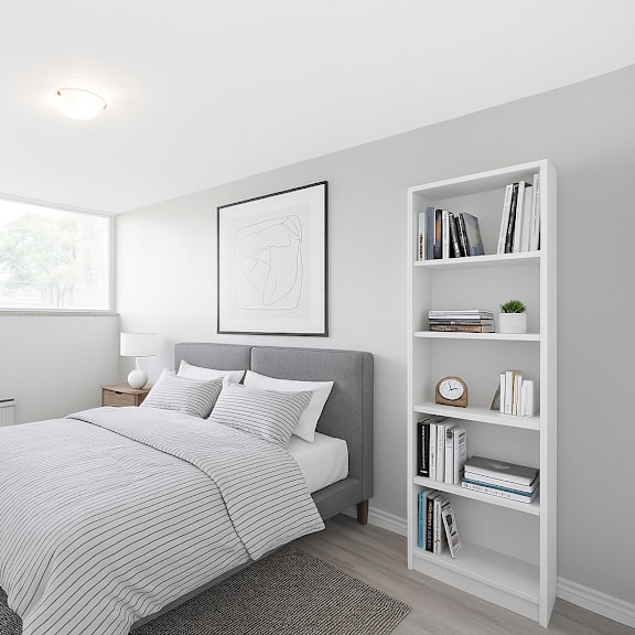 a bedroom with a large bed and a bookshelf.