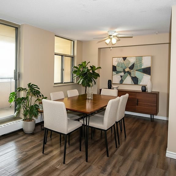 a dining room with a table and chairs.