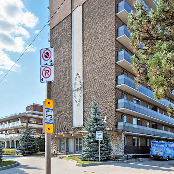a building with a no parking sign in front of it.
