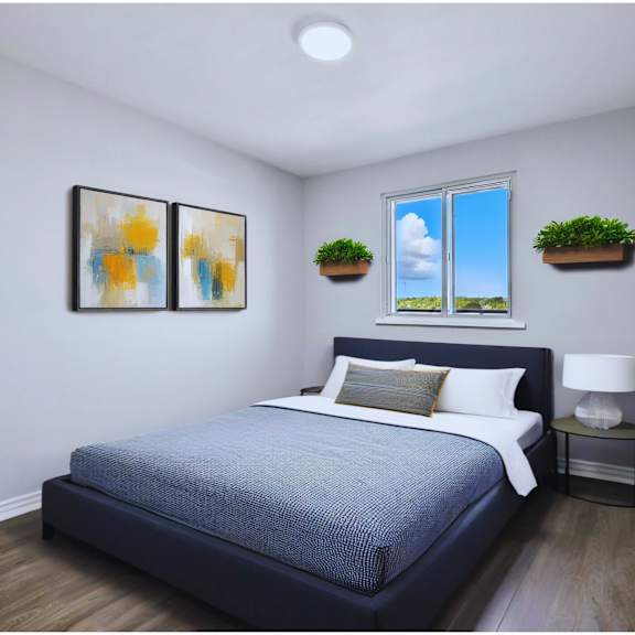 a bedroom with a bed, nightstand, and two framed pictures on the wall.