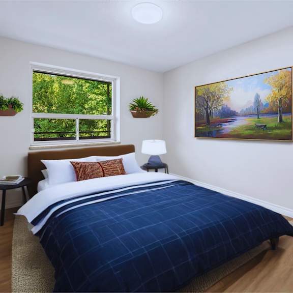a bedroom with a large bed and a painting on the wall.