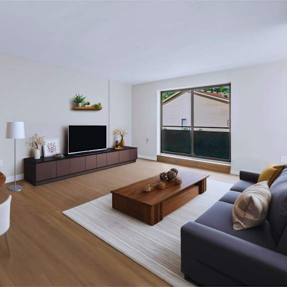 a living room with a wooden table and chairs, a couch, and a painting on the wall.