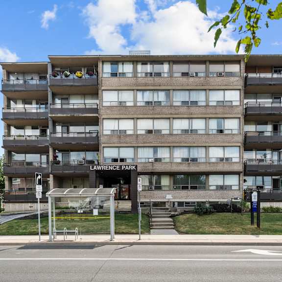 a large apartment building with the name lawrence park on the front.