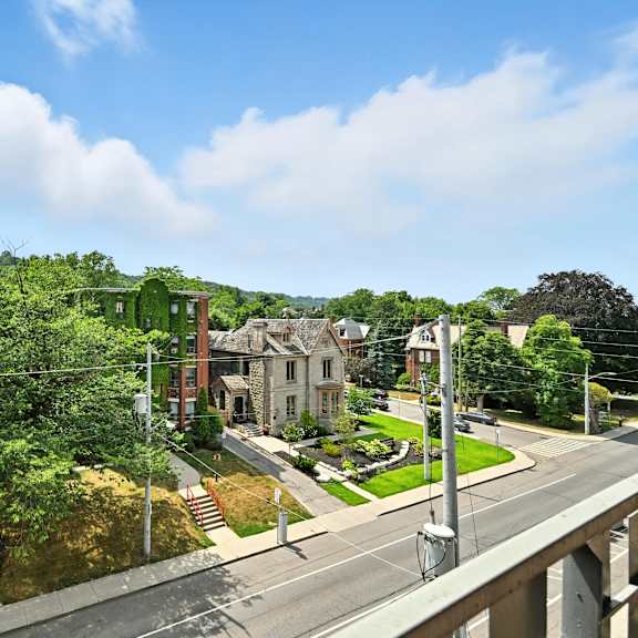 a street view of a residential area with houses on both sides.