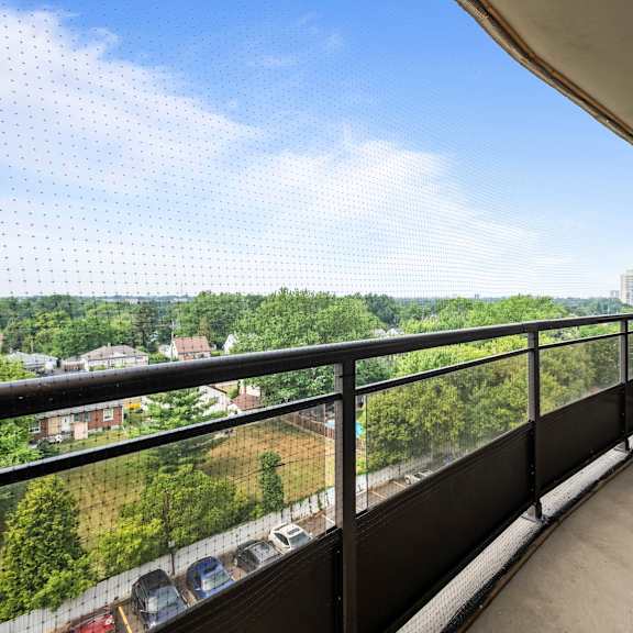 a balcony with a view of a residential area.