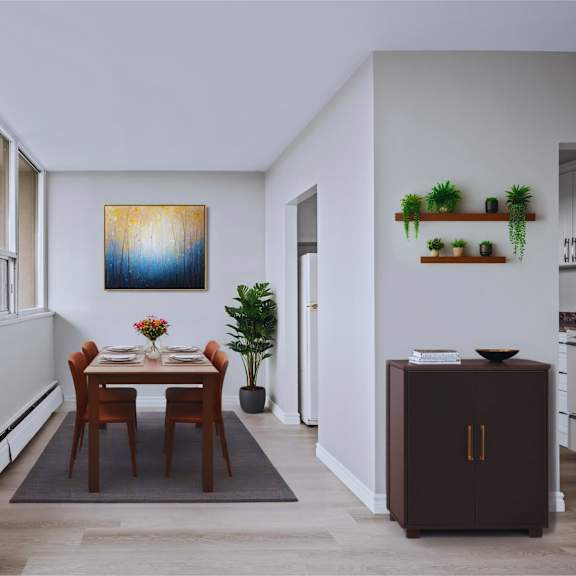a dining room with a table and chairs and a painting on the wall.