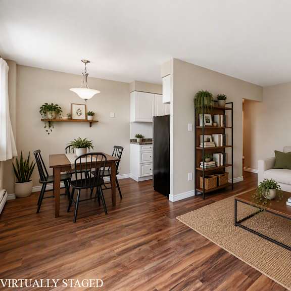 a living room with a couch, a dining table, and a coffee table.