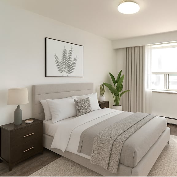 a bedroom with a large bed, a chair, and a potted plant.