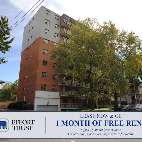 a large brick building with a sign in front that says "lease now & get 1 month free rent".