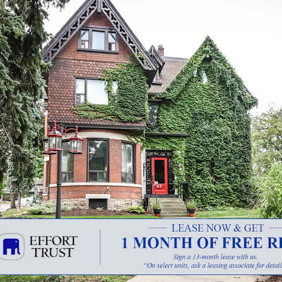 a house with a sign offering 1 month of free rent.